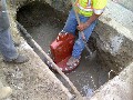 Concrete is evened out over the top of the pipeline and bottom of the Insert Valve