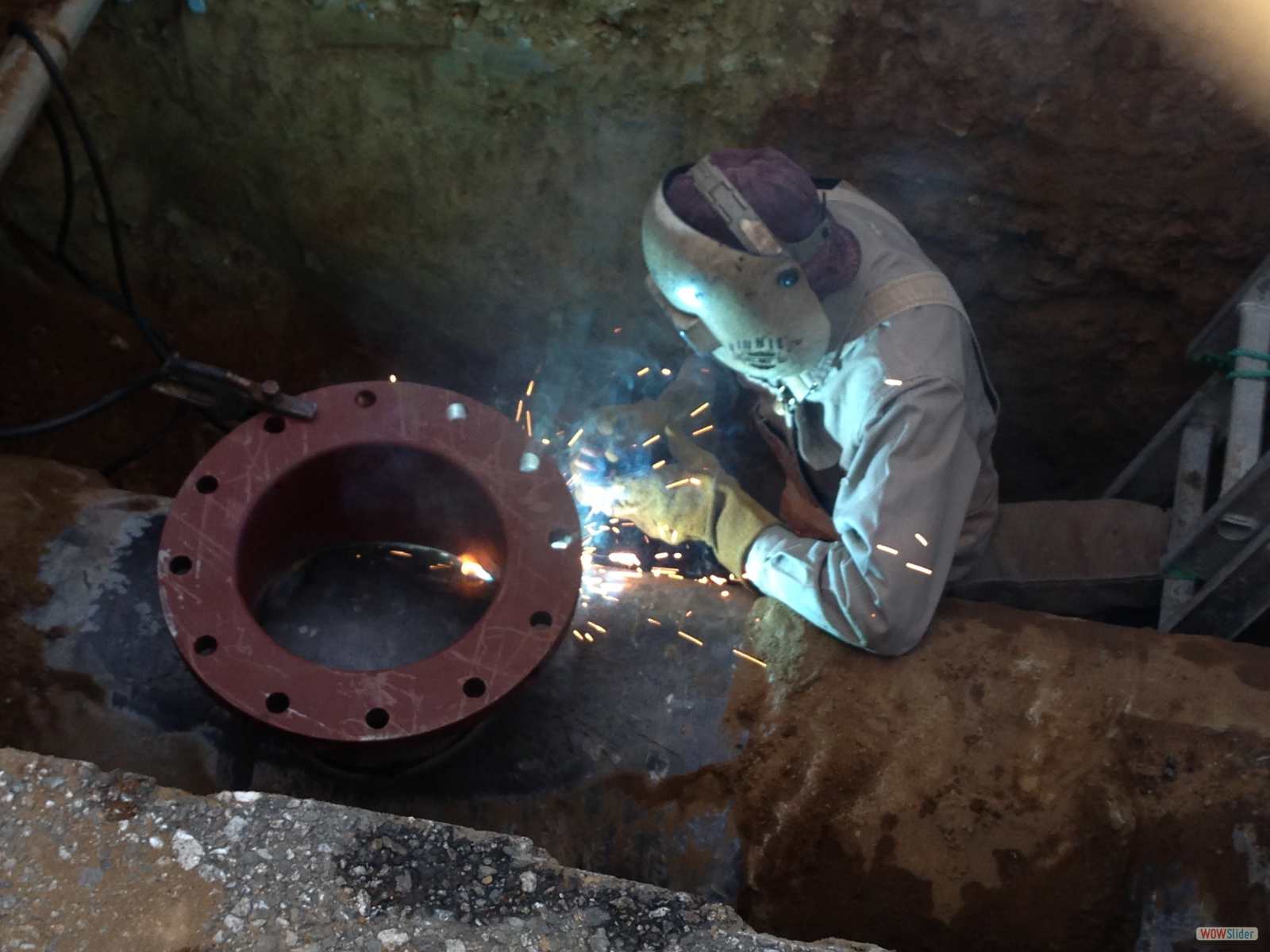 Welder is welding an 12inch Flange of CMLC Pipline